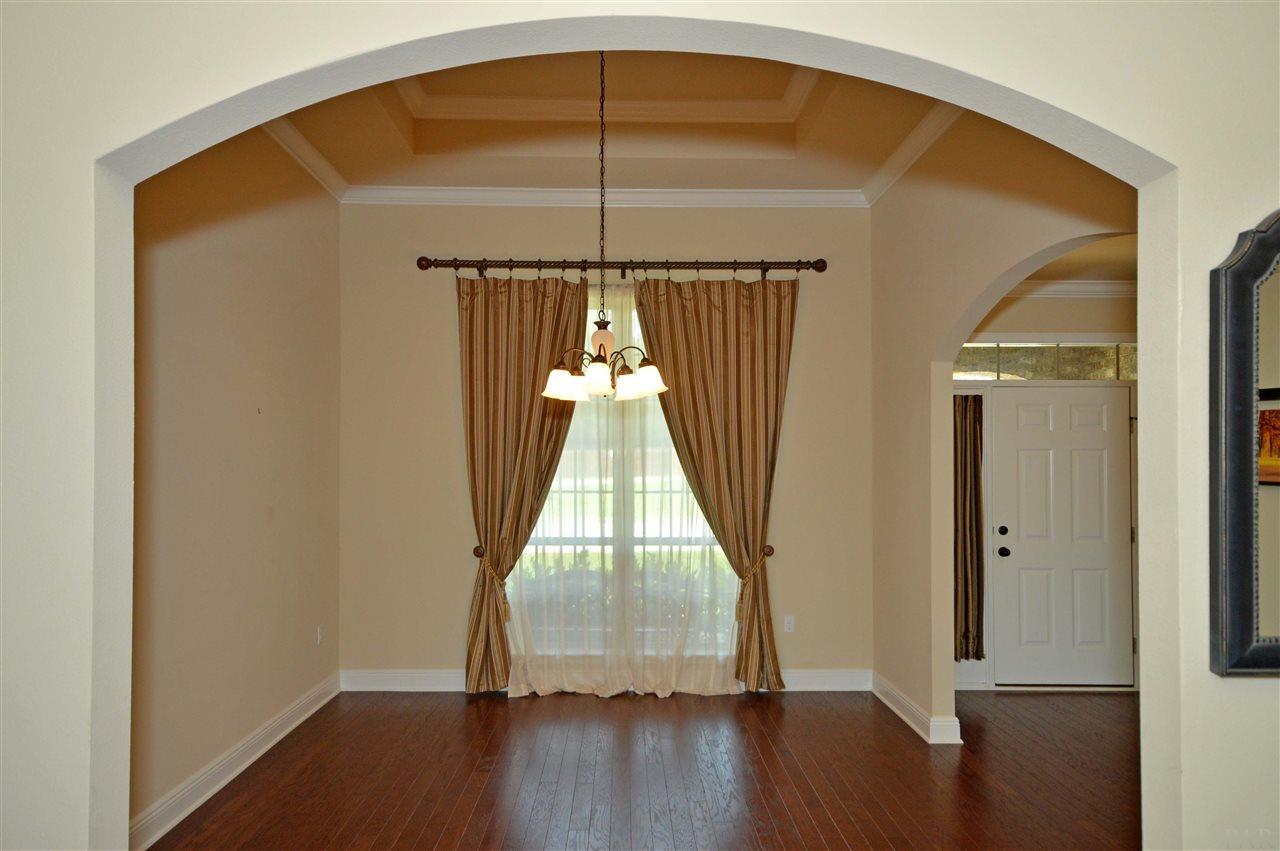 759 Lake Ridge Lane Pensacola, FL 32514 - Photo 39 of 43 a view of a room with wooden floor and white walls