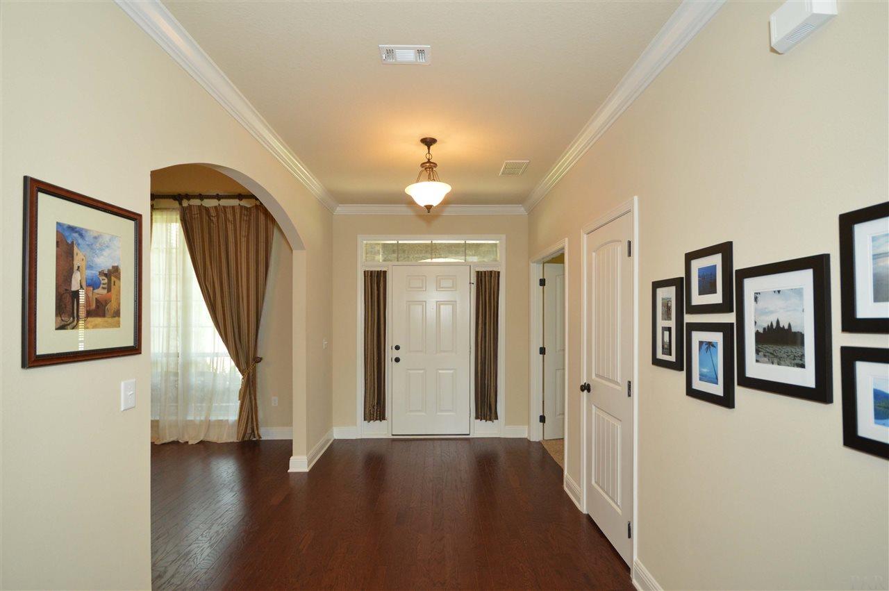 759 Lake Ridge Lane Pensacola, FL 32514 - Photo 40 of 43 a view of a hallway with wooden floor and staircase