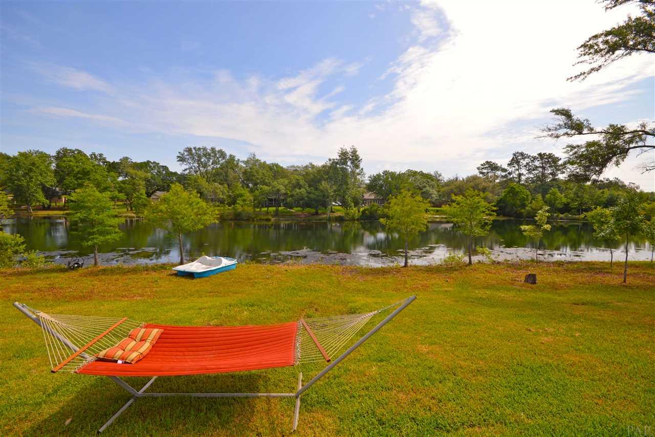 759 Lake Ridge Lane Pensacola, FL 32514 - Photo 5 of 43 a view of a swimming pool with an ocean view