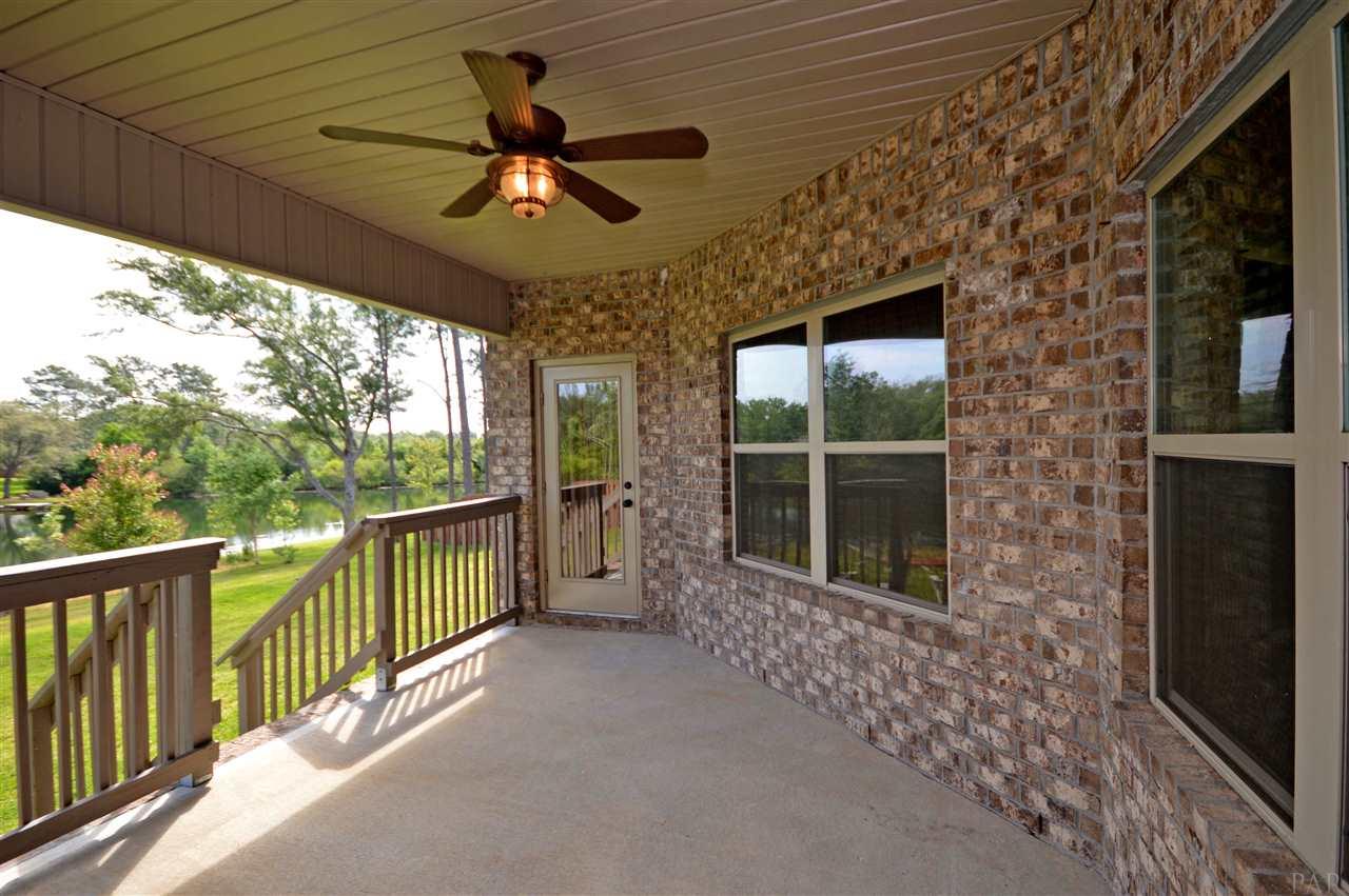 759 Lake Ridge Lane Pensacola, FL 32514 - Photo 8 of 43 a view of a livingroom with a ceiling fan and a window