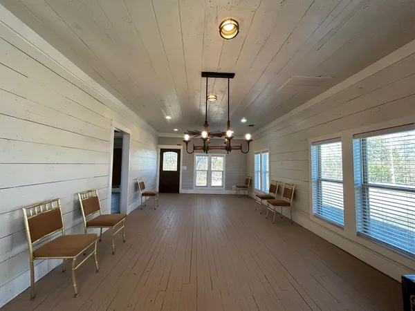 a view of a livingroom with furniture and windows