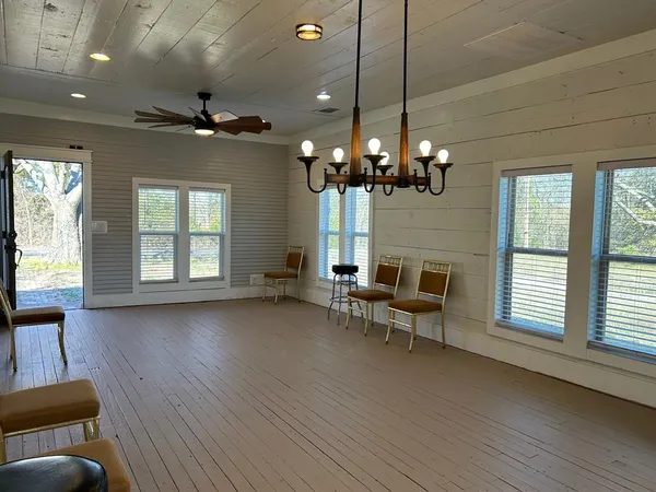 a kitchen with appliances a sink cabinets and a window