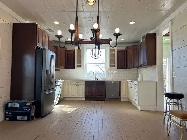 a kitchen with sink cabinets and window