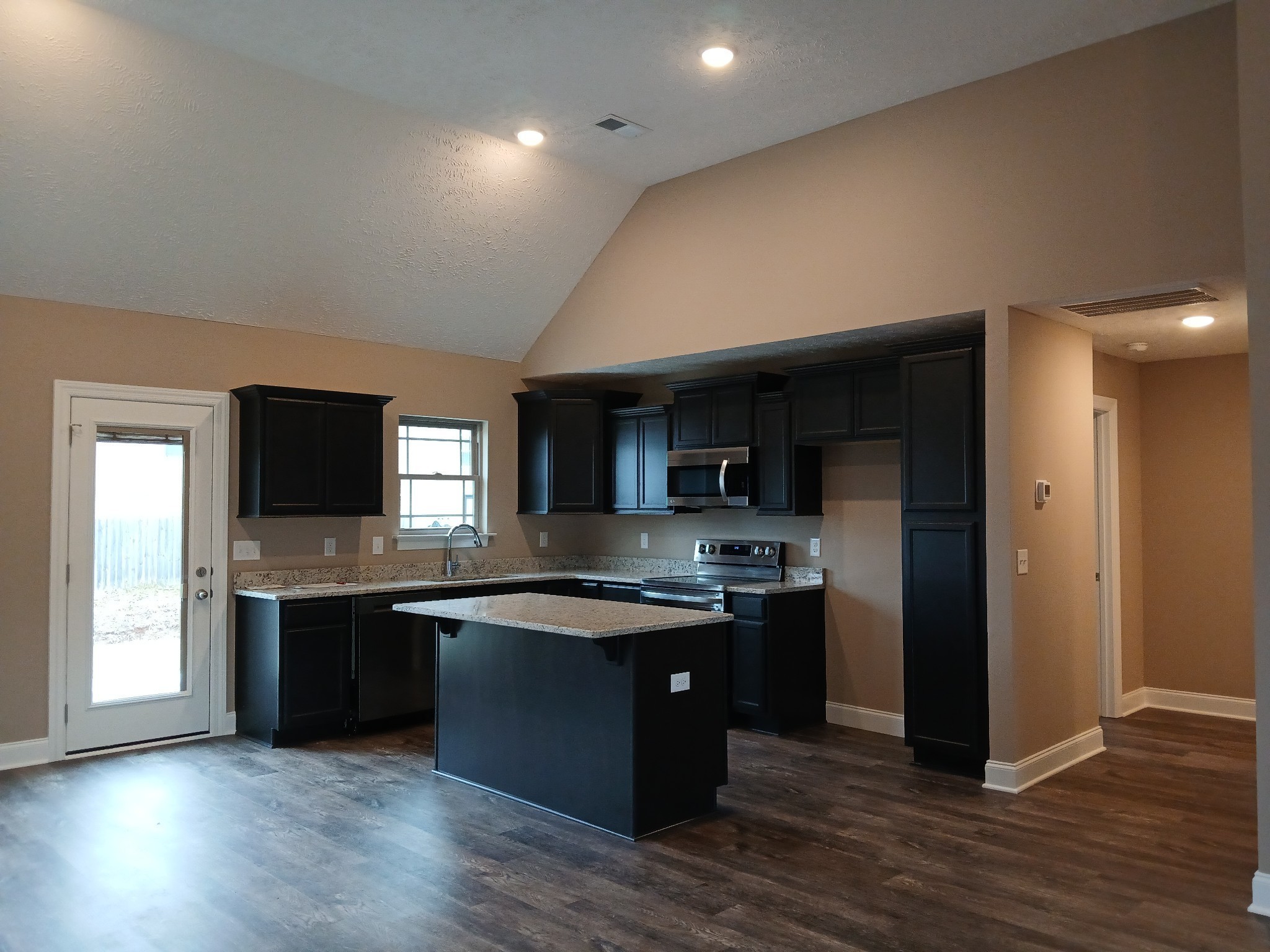 2859 Upstream Road Christiana, TN 37037 - Photo 13 of 72 a kitchen with stainless steel appliances granite countertop a stove and a refrigerator