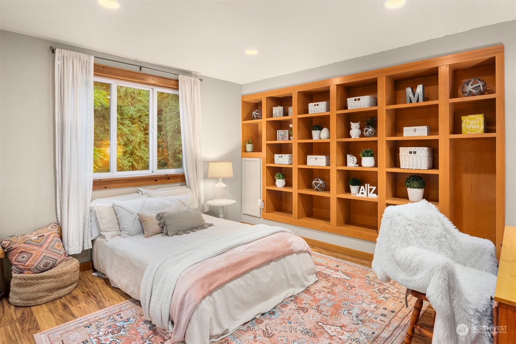 11417 Kelly Road Northeast Carnation, WA 98014 - Photo 18 of 39 a spacious bedroom with a bed and a large window