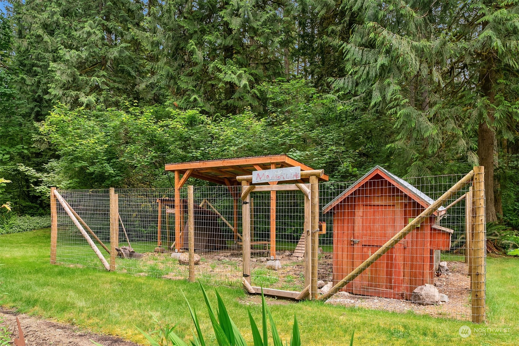 11417 Kelly Road Northeast Carnation, WA 98014 - Photo 21 of 39 a view of house with a yard and sitting area