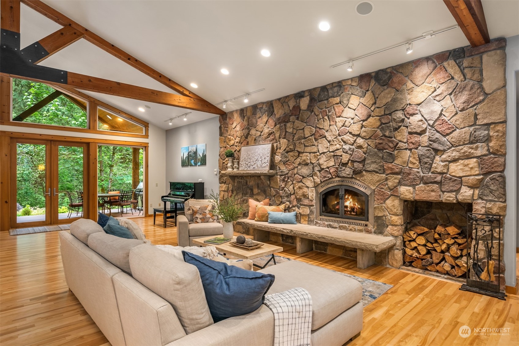 11417 Kelly Road Northeast Carnation, WA 98014 - Photo 35 of 39 a living room with fireplace furniture and a large window