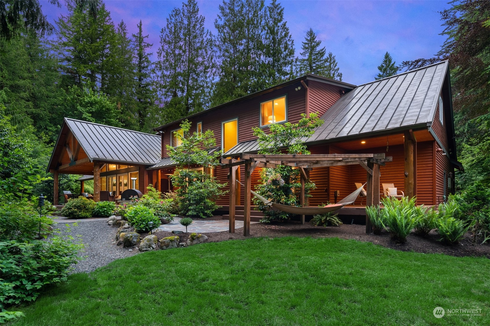 11417 Kelly Road Northeast Carnation, WA 98014 - Photo 38 of 39 a view of a house with a yard and sitting area