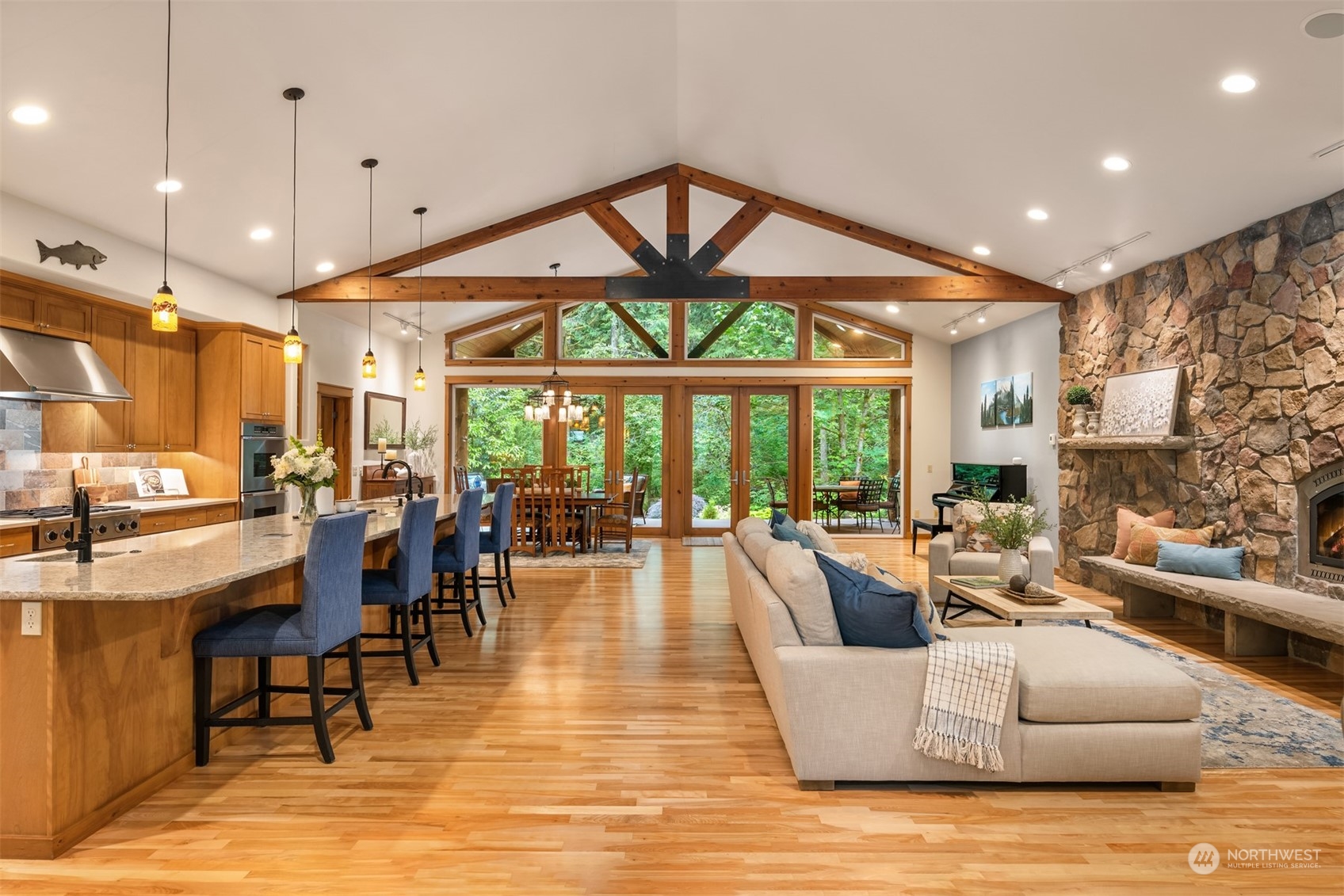 11417 Kelly Road Northeast Carnation, WA 98014 - Photo 8 of 39 a living room with fireplace furniture and a large window