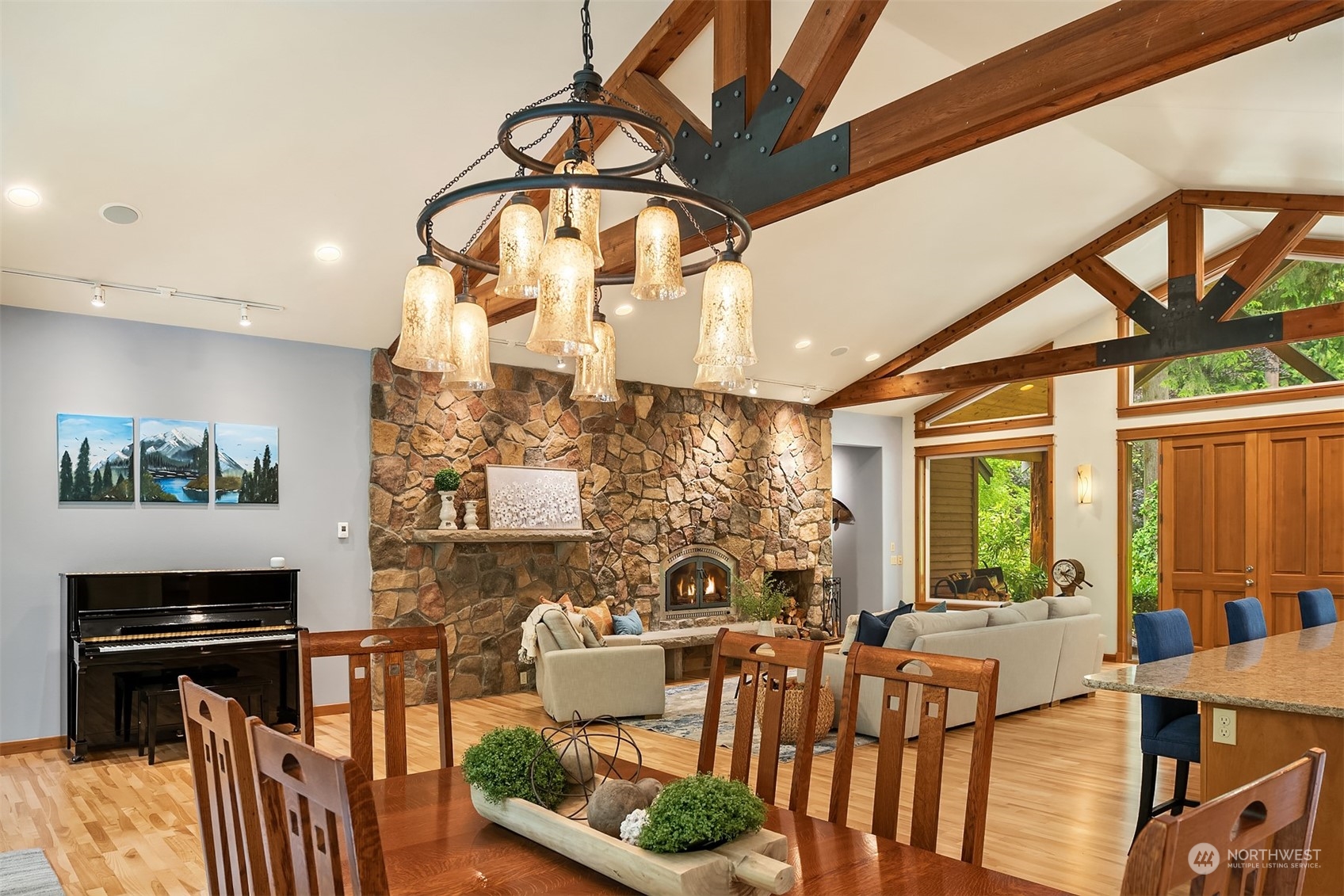 11417 Kelly Road Northeast Carnation, WA 98014 - Photo 9 of 39 a living room with fireplace furniture and a flat screen tv