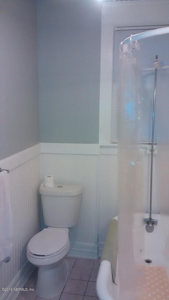 1350 Silver Street Jacksonville, FL 32206 - Photo 19 of 21 a white toilet sitting next to a bathroom sink