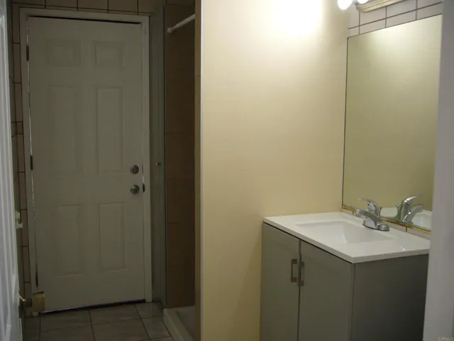 a bathroom with a sink and mirror