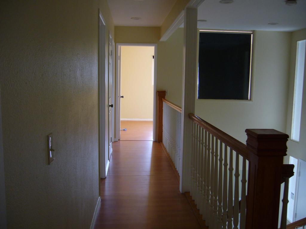 5191 Bothe Avenue University City, CA 92122 - Photo 21 of 29 a view of a hallway with wooden floor