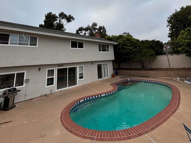a view of a house with swimming pool