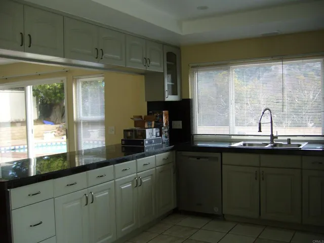 a kitchen with sink and window