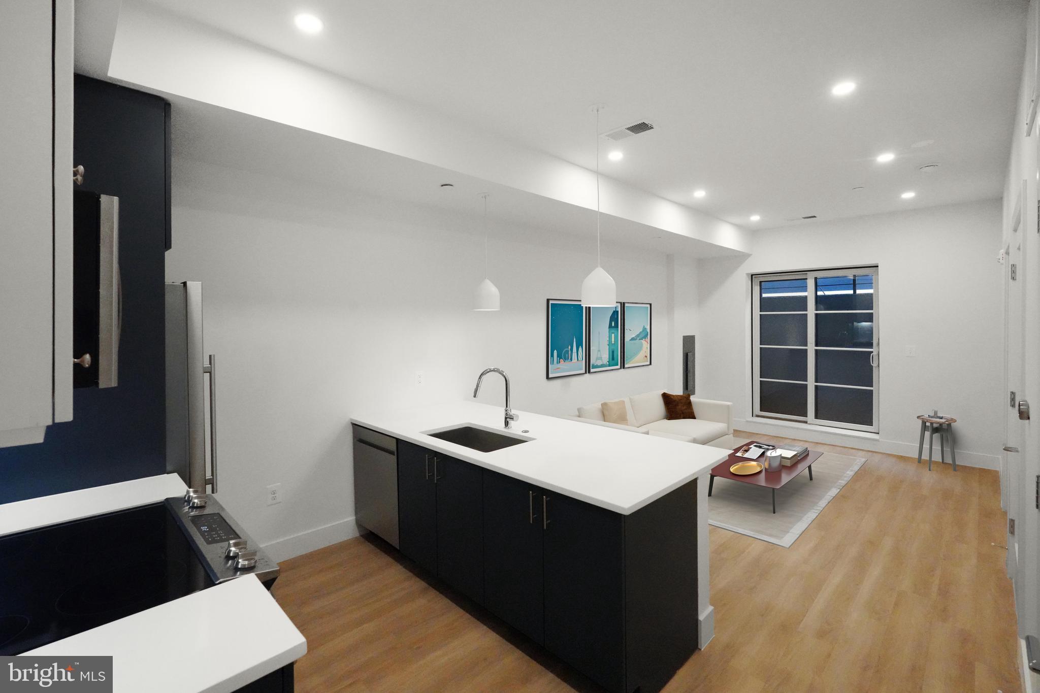 2310 4th Street Northeast, Unit 2 Washington, DC 20002 - Photo 1 of 31 a living room with a sink furniture and a large window