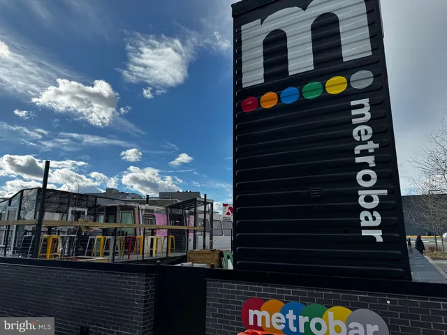 a view of a cafe with an outdoor seating