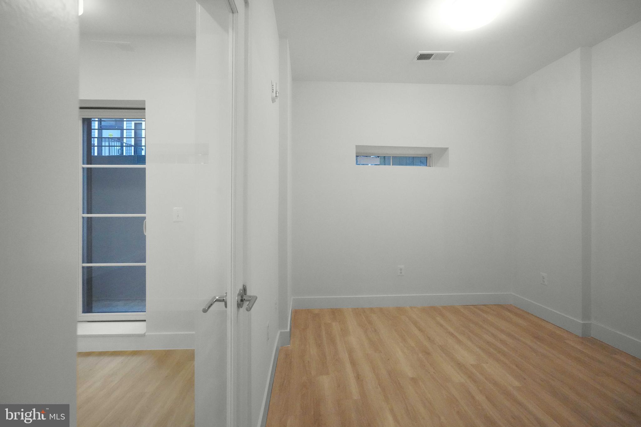 2310 4th Street Northeast, Unit 2 Washington, DC 20002 - Photo 8 of 31 wooden floor in an empty room