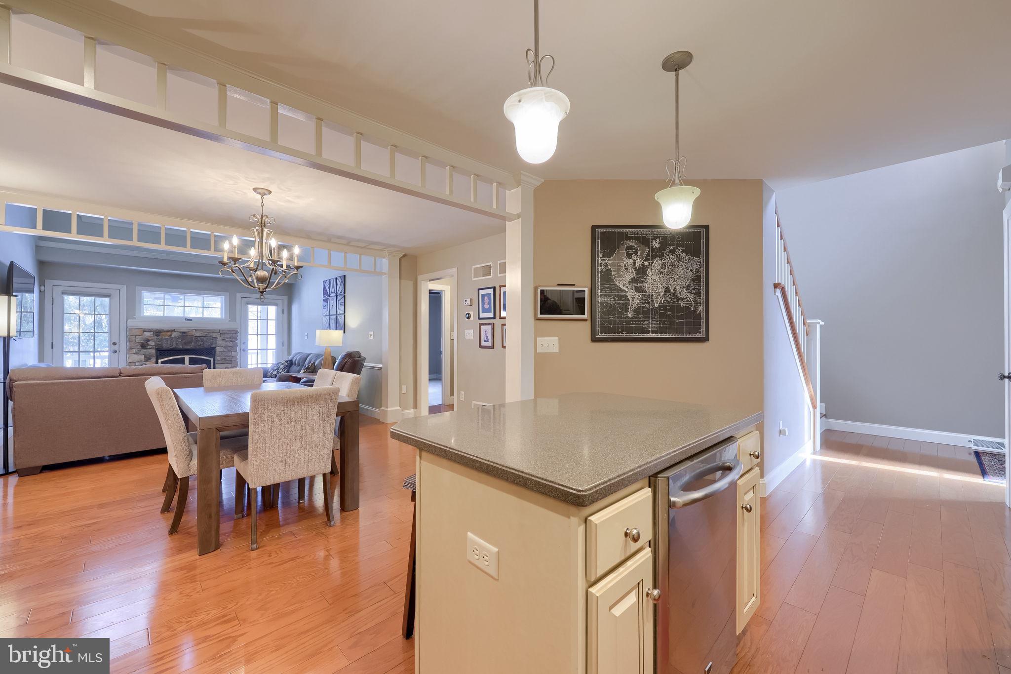 147 Fieldcrest Lane Ephrata, PA 17522 - Photo 11 of 47 a dining room with wooden floor a chandelier a wooden table and chairs