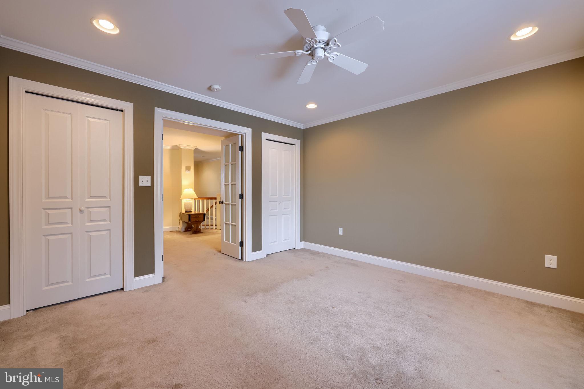 147 Fieldcrest Lane Ephrata, PA 17522 - Photo 33 of 47 an empty room with a ceiling fan and closet area