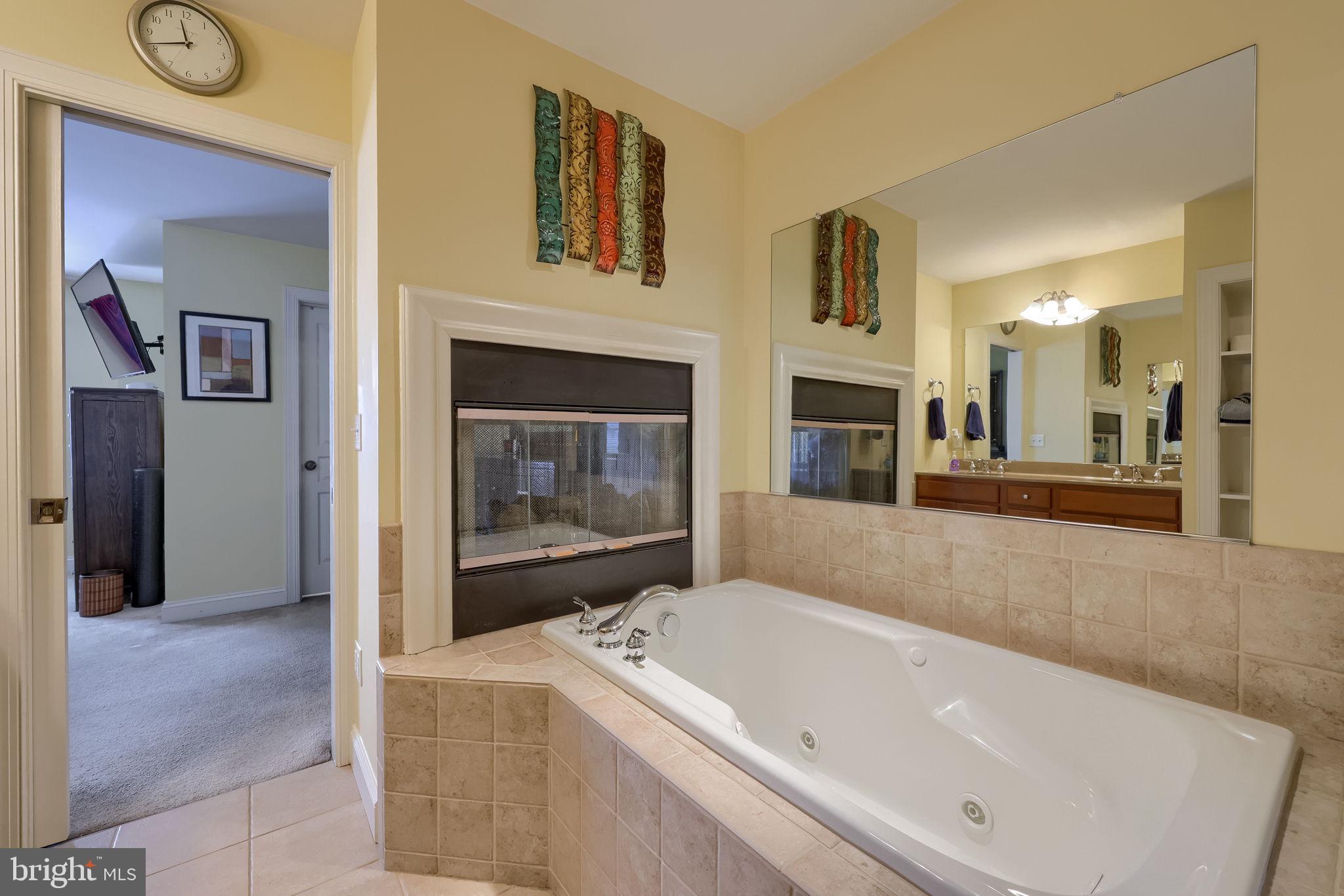 147 Fieldcrest Lane Ephrata, PA 17522 - Photo 37 of 47 a bathroom with a tub a mirror and a shower