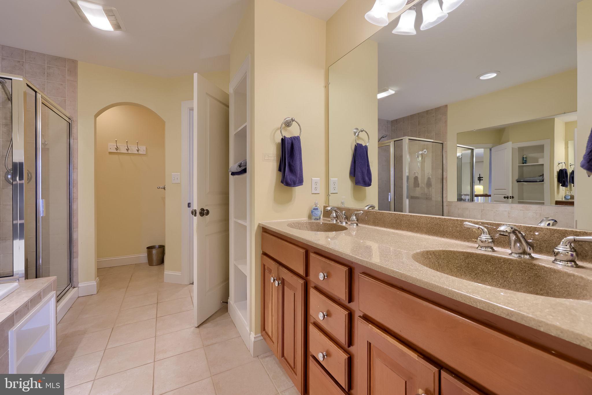 147 Fieldcrest Lane Ephrata, PA 17522 - Photo 38 of 47 a spacious bathroom with a double vanity sink and a mirror