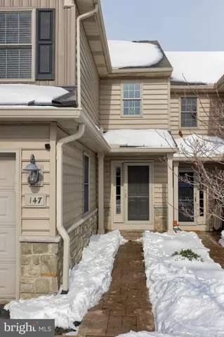 a view of a house with entrance gate