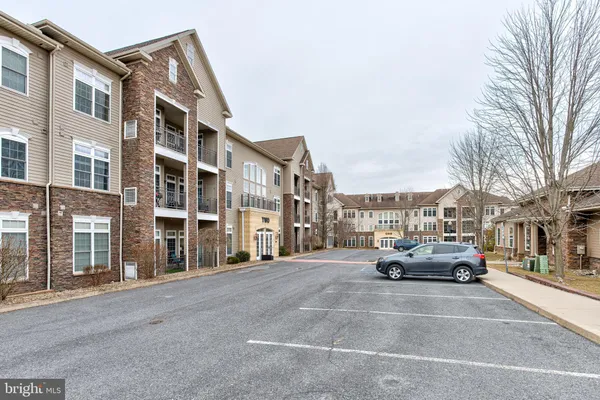 a cars parked in front of brick building