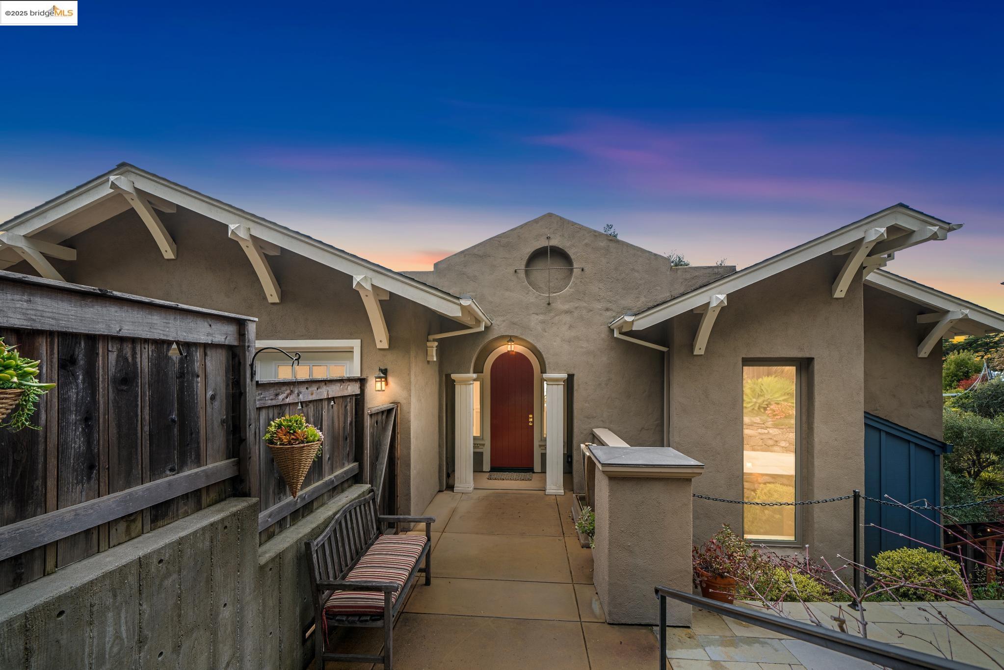 a view of living room kitchen with furniture and a fireplace