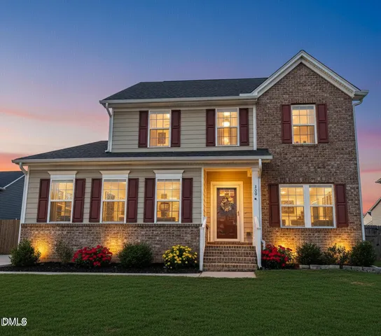 a front view of a house with a yard