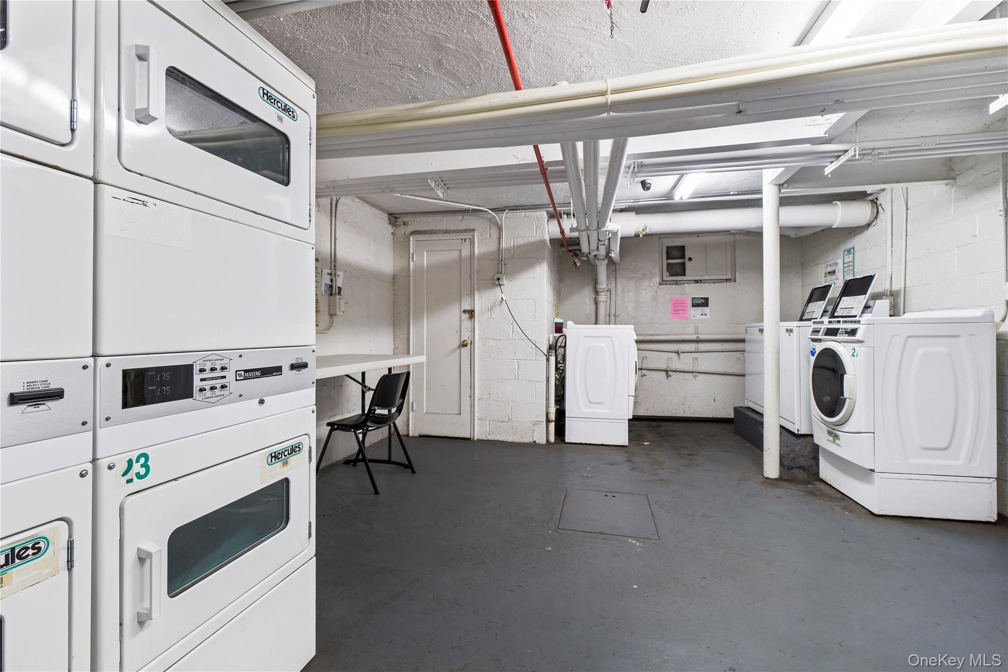 78-11 Main Street, Unit 1G Queens, NY 11367 - Photo 12 of 15 a utility room with dryer and washer