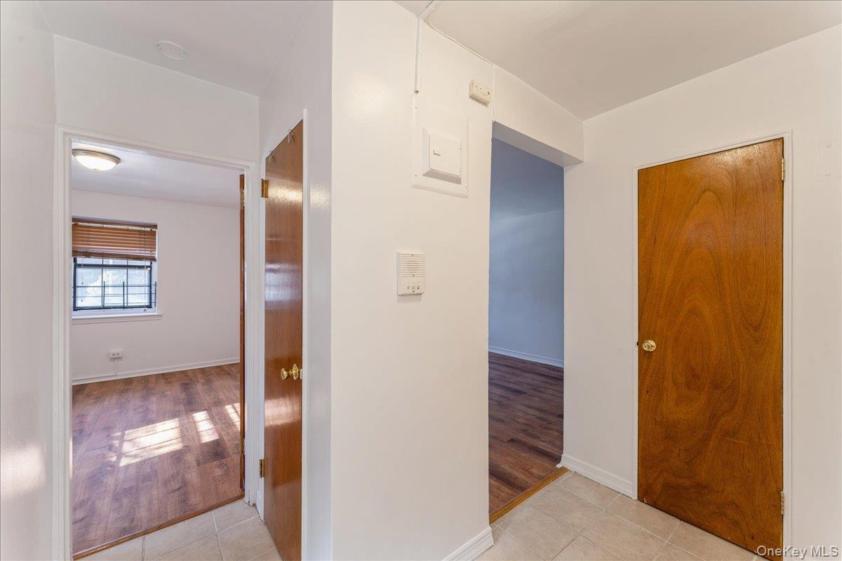 78-11 Main Street, Unit 1G Queens, NY 11367 - Photo 4 of 15 a view of a hallway with wooden floor
