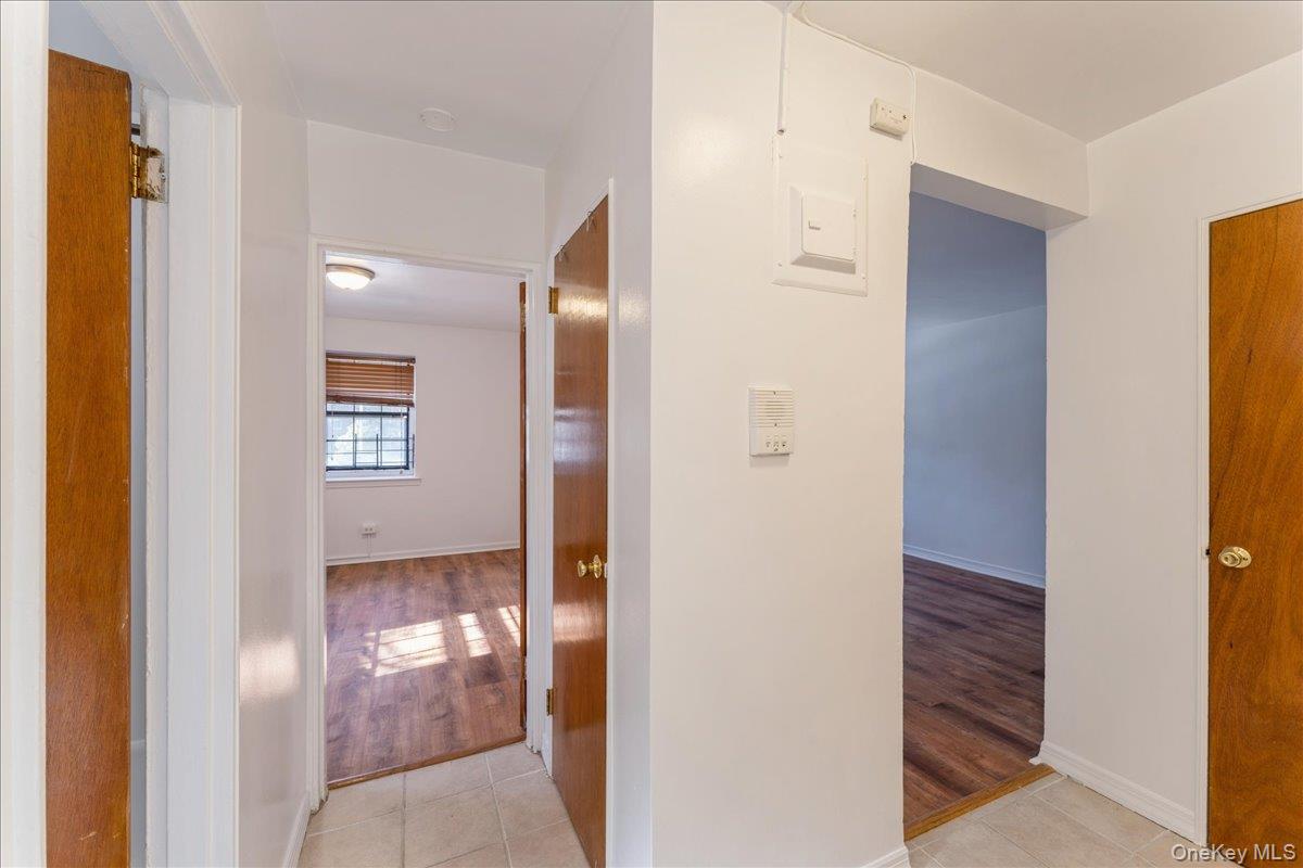 78-11 Main Street, Unit 1G Queens, NY 11367 - Photo 5 of 15 a view of a bathroom from a hallway