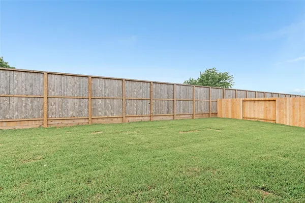 a view of a backyard with a small cabin