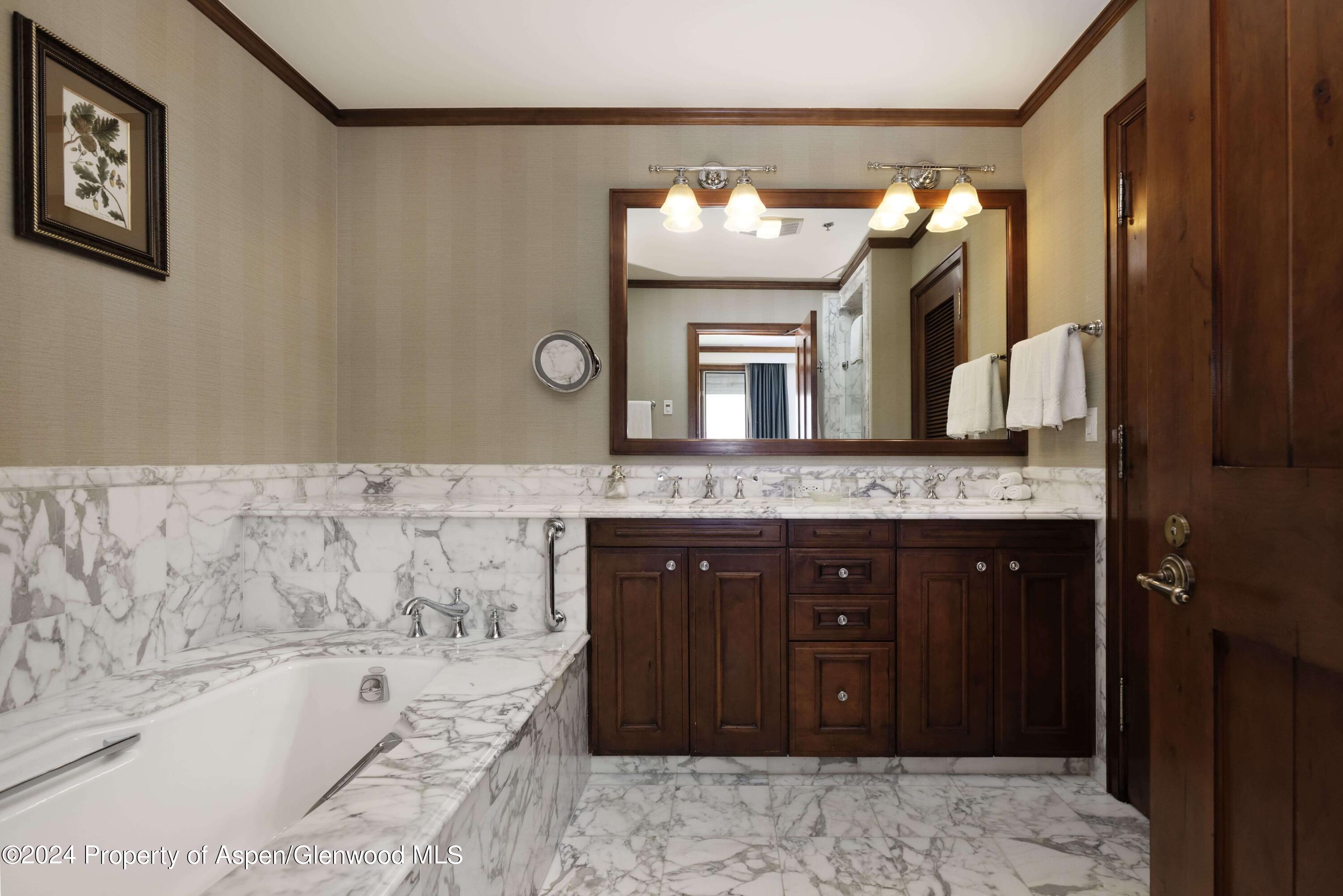 133 Prospector Road, Unit 43016 Aspen, CO 81611 - Photo 13 of 21 a bathroom with a sink and a mirror