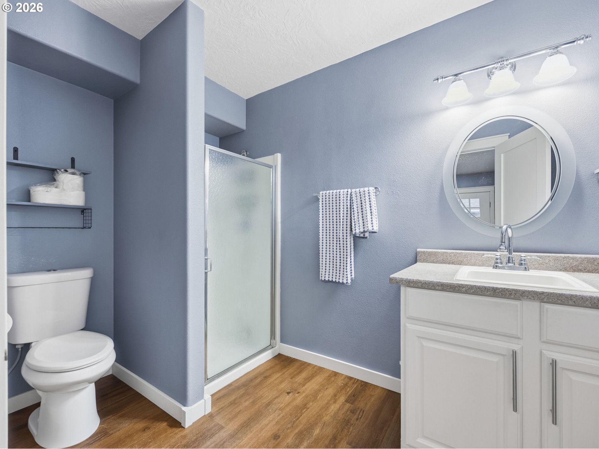 92085 Akerstedt Road Astoria, OR 97103 - Photo 30 of 48 a bathroom with a toilet a sink and mirror