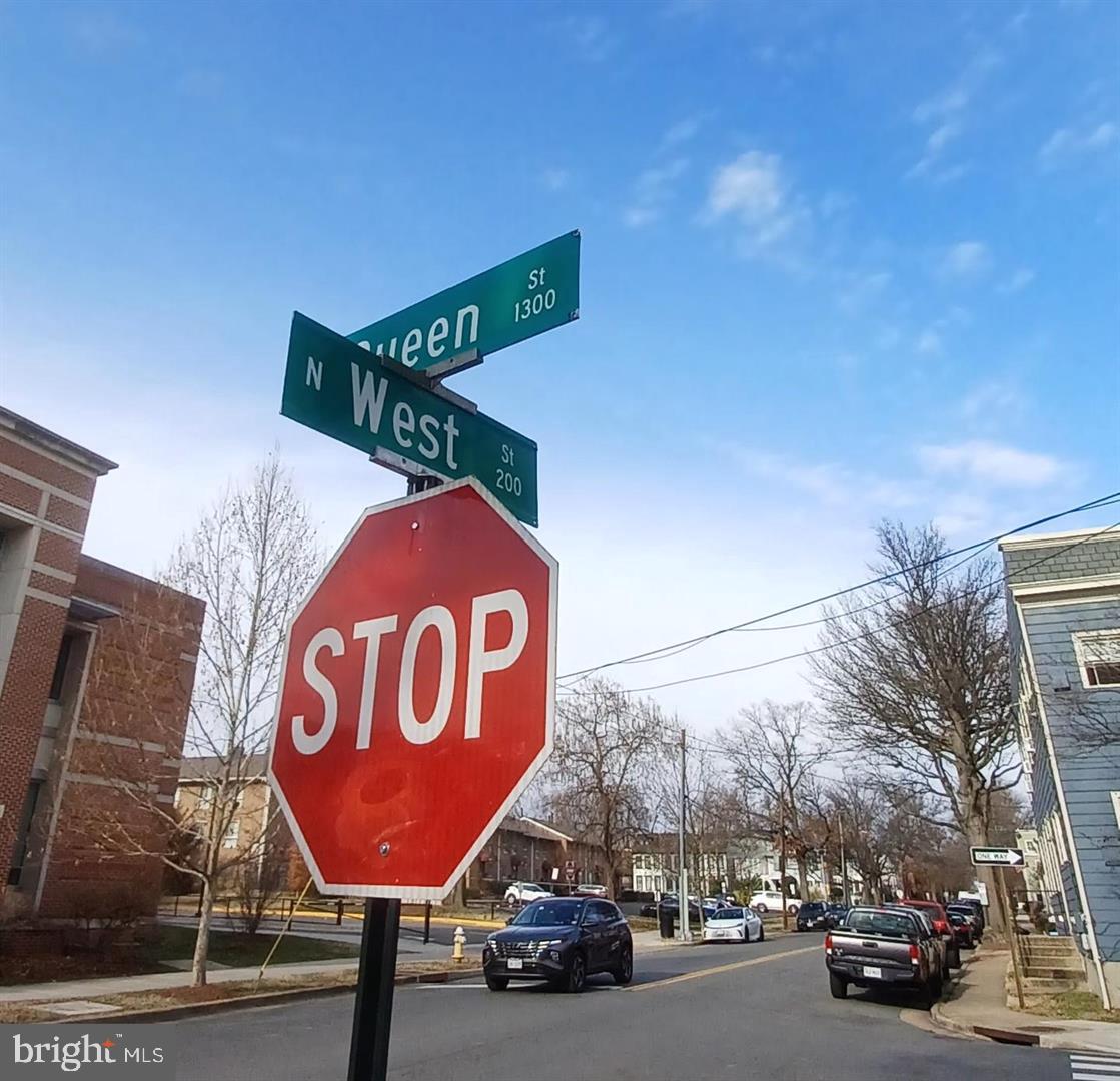 301 North West Street, Unit 1 Alexandria, VA 22314 - Photo 11 of 16 a view of a street sign on a pole on a street