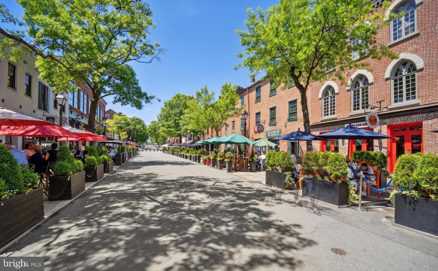 301 North West Street, Unit 1 Alexandria, VA 22314 - Photo 12 of 16 a street view with tall buildings and a yard