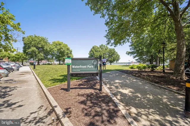 a view of a swimming pool with a yard