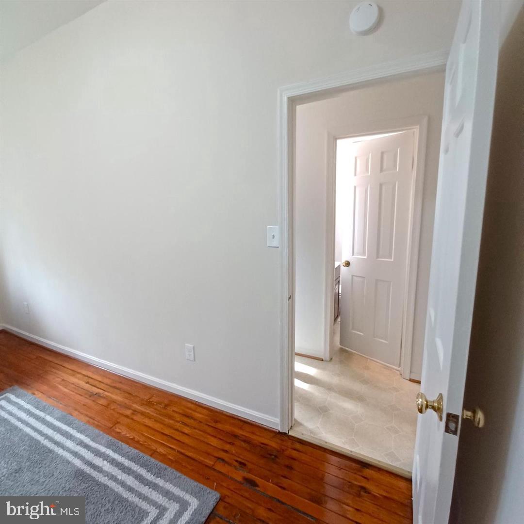 301 North West Street, Unit 1 Alexandria, VA 22314 - Photo 5 of 16 a view of a bathroom with wooden floor