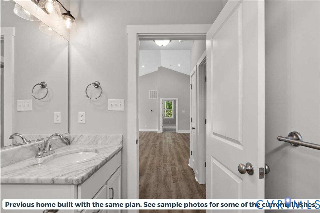 5712 Darlington Heights Road Farmville, VA 23901 - Photo 19 of 22 Bathroom with vanity, lofted ceiling, and dark woo