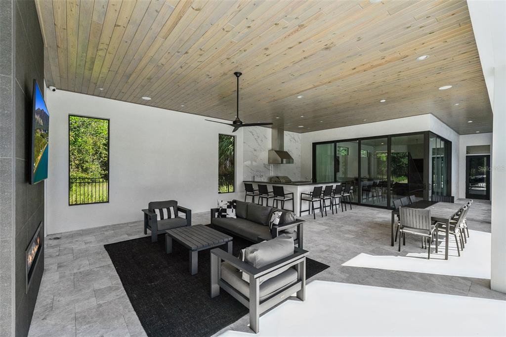 15746 Pendio Drive Montverde, FL 34756 - Photo 40 of 71 a living room with furniture and a large window