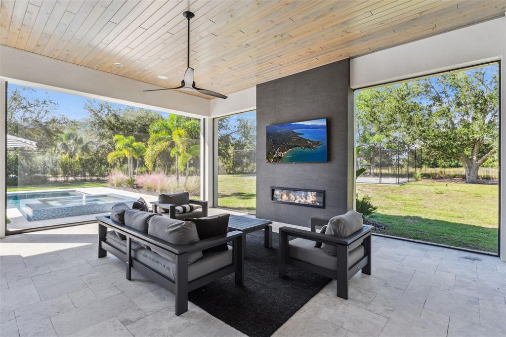 15746 Pendio Drive Montverde, FL 34756 - Photo 42 of 71 a living room with furniture and a floor to ceiling window