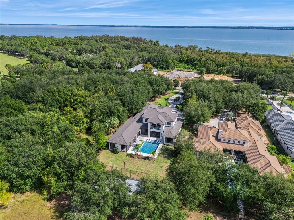 15746 Pendio Drive Montverde, FL 34756 - Photo 58 of 71 an aerial view of a house with a yard