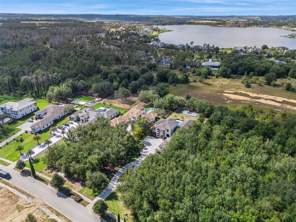 15746 Pendio Drive Montverde, FL 34756 - Photo 59 of 71 an aerial view of a town with couple of houses
