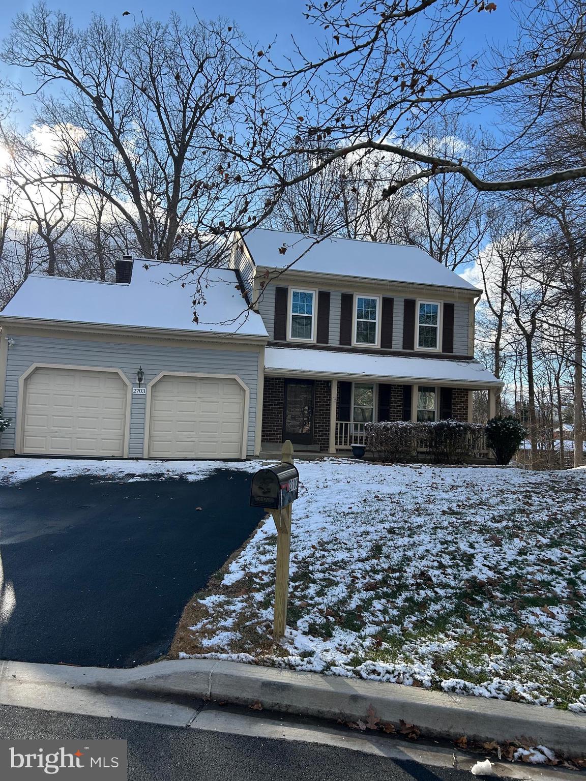 a front view of a house with garage