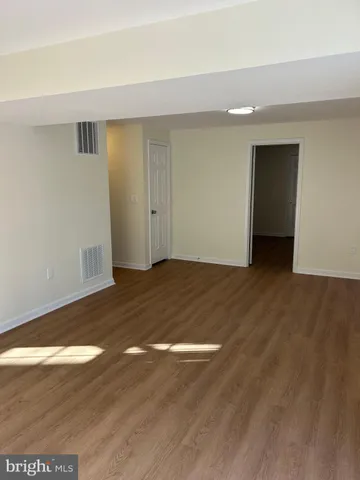 a view of kitchen with wooden floor