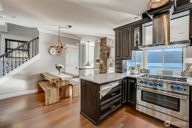 a kitchen with stainless steel appliances granite countertop a stove and a sink