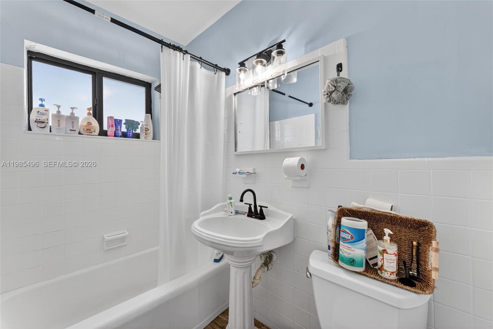 440 East 37th Street Hialeah, FL 33013 - Photo 11 of 27 a bathroom with a sink and a mirror