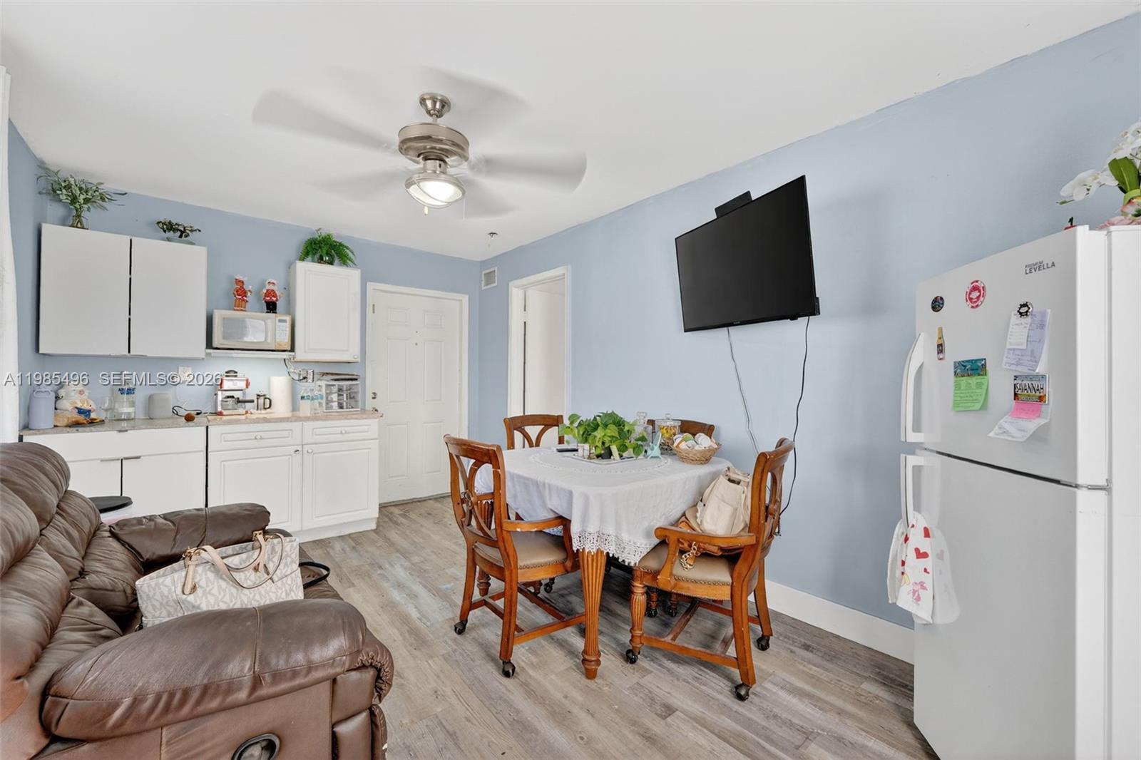 440 East 37th Street Hialeah, FL 33013 - Photo 18 of 27 a view of a dining room with furniture and wooden floor